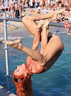 Naked teen nudist lets the water kiss her body