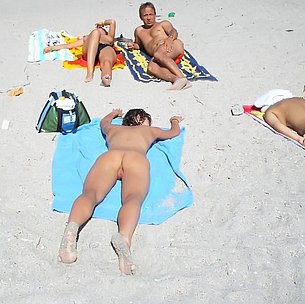 Nudist beach shows off two gorgeous naked teens